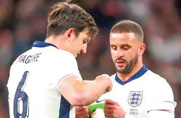 Harry Maguire and Kyle Walker (R)