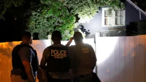 Secret Service and Homeland Security agents check a former home of a suspect named by news organizations as Ryan Wesley Routh